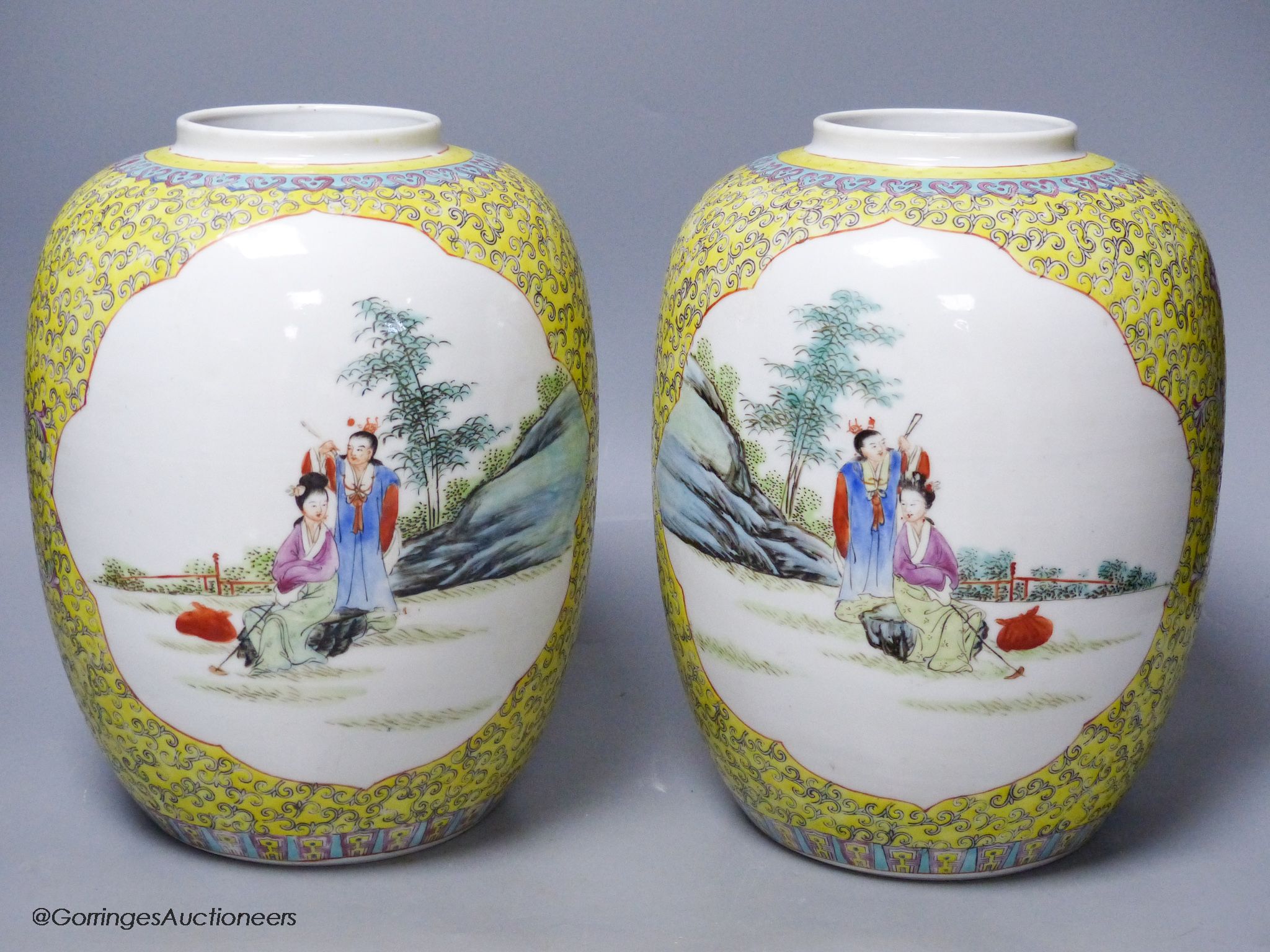 A pair of Chinese yellow ground vases and covers, height 30cm